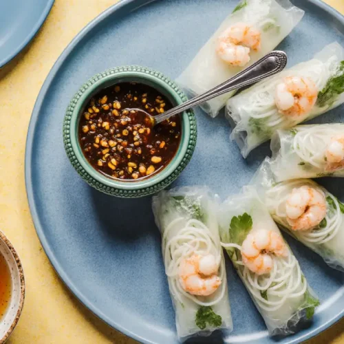 Vietnamese Fresh Spring Rolls with Shrimp served with herbs and dipping sauce