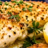 Baked haddock fillets with golden crispy garlic herb breadcrumbs, fresh parsley and lemon