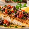Golden pan seared grouper fillet topped with cherry tomatoes, Kalamata olives, red onion and parsley, served with lemon