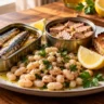Tinned Seafood for Easy Dinners Opened tins of sardines and tuna with white beans, toast, and lemon